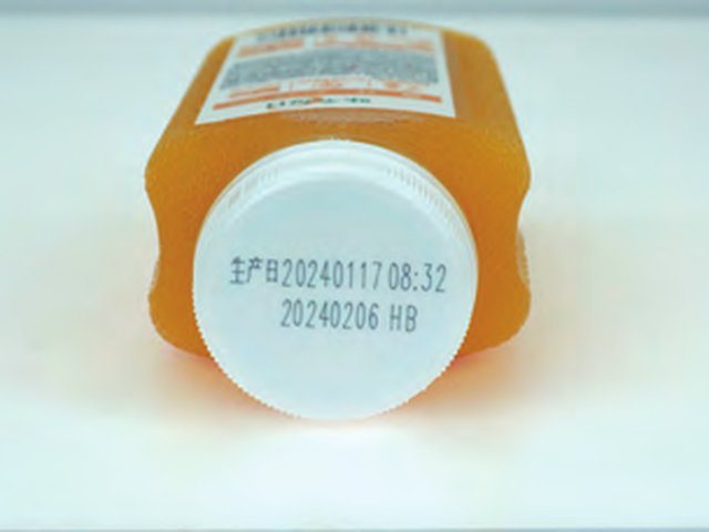UV laser date code on a bottle closure